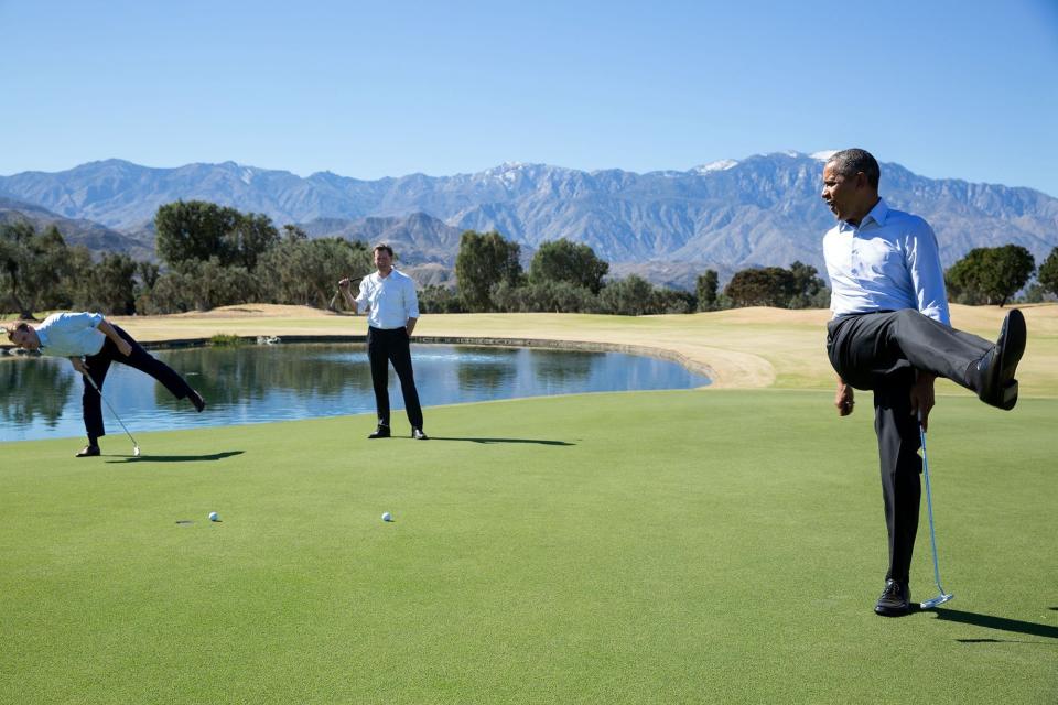Obama reacts as his putt falls just short during an impromptu hole of golf with staffers Joe Paulsen, left, and Marvin Nicholson after the U.S.-ASEAN Summit at the Annenberg Retreat at Sunnylands in Rancho Mirage, California, on Feb. 16.