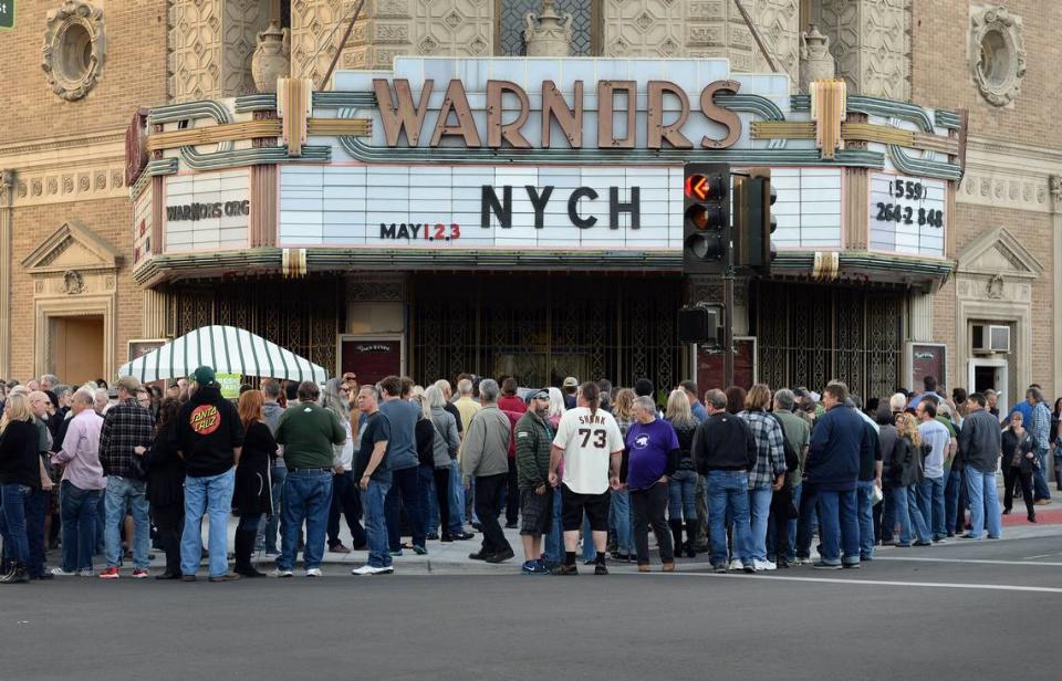 Fans wait to pick up their will call tickets outside Warnors Theatre on the first night of the Neil Young and Crazy Horse concert on Tuesday, May 1, 2018. Young and Crazy Horse last performed together in 2014.