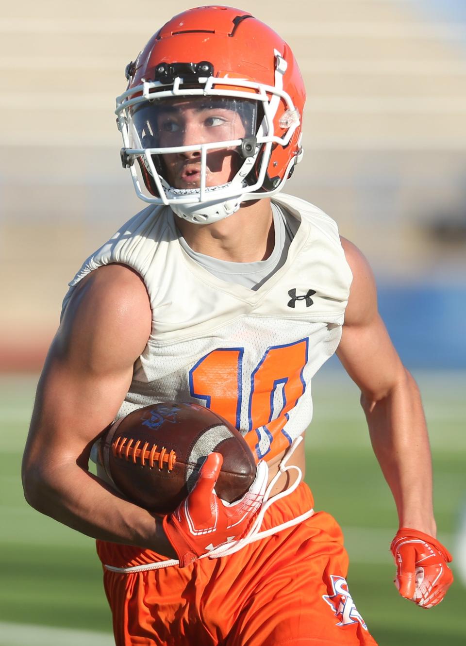 A San Angelo Central High School receiver makes a reception during the first preseason practice at San Angelo Stadium on Monday, Aug. 8, 2022.