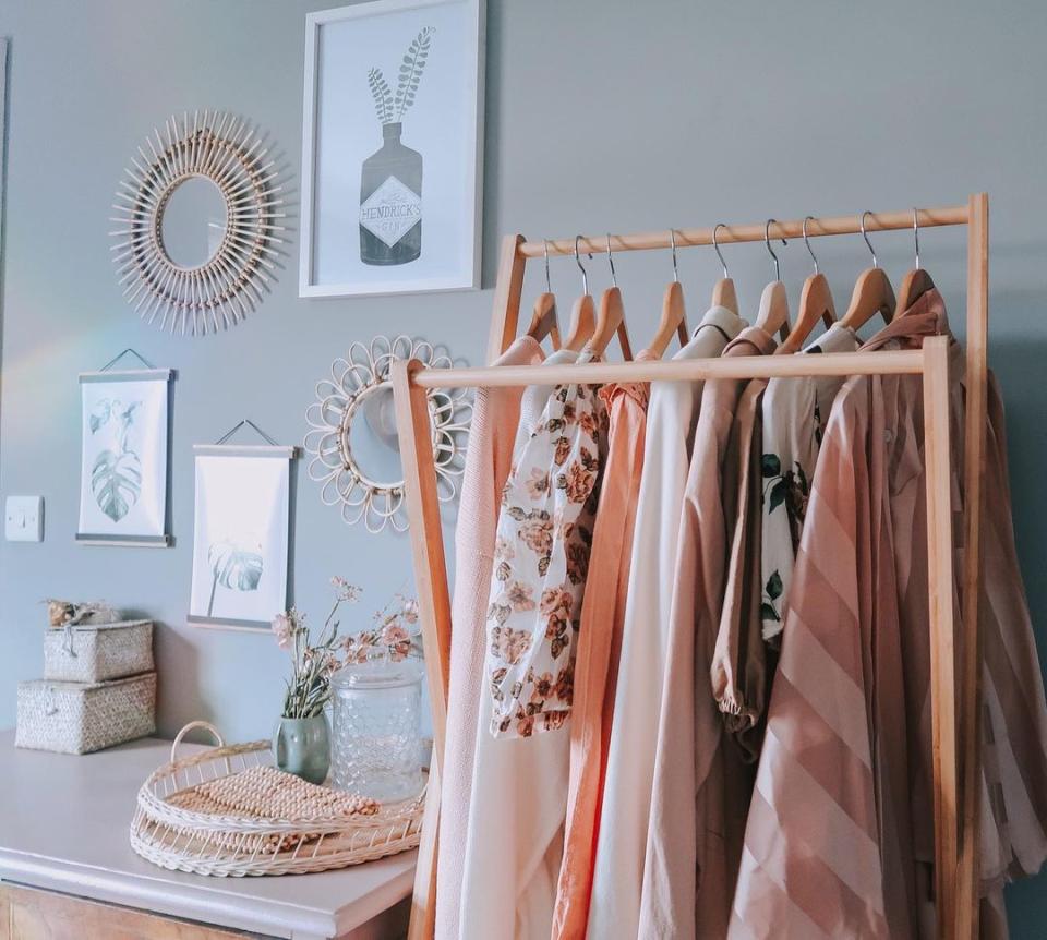 A clothes rack with colorful clothes on them