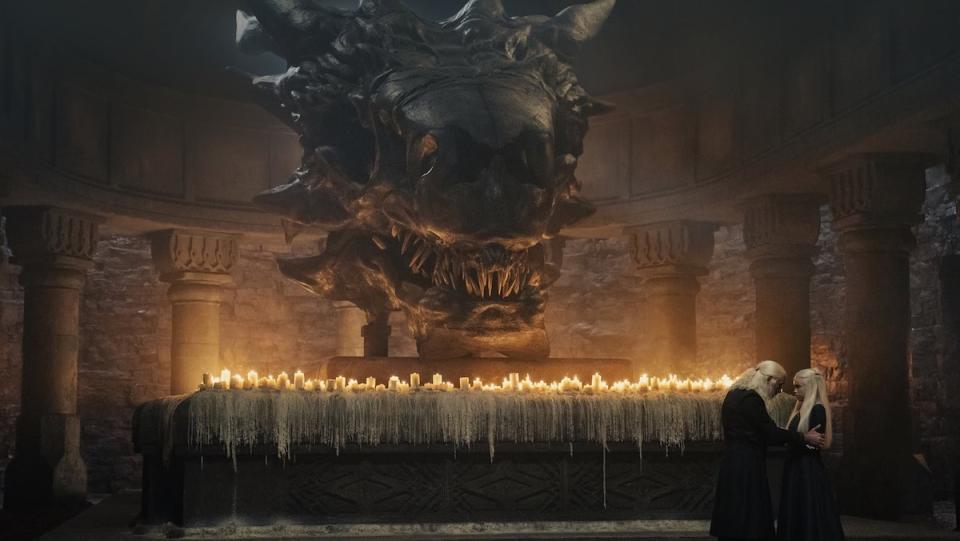 VIserys Talks to Rhaenyra in front of Balerion's skull and candles on House of the Dragon