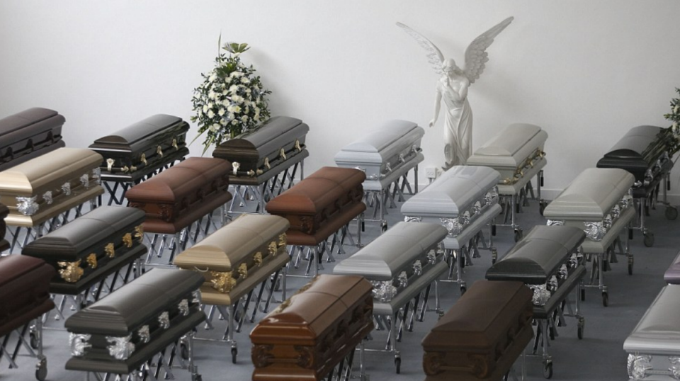 A heartbreaking image of coffins containing the killed Brazilian footballers has been released. Photo: AFP/ GETTY