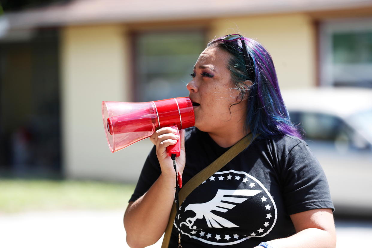 Sweet Gonzelaz, a member of the 'Community Patriots', protests against wearing masks in schools in Largo, Florida,  August 9, 2021. REUTERS/Octavio Jones