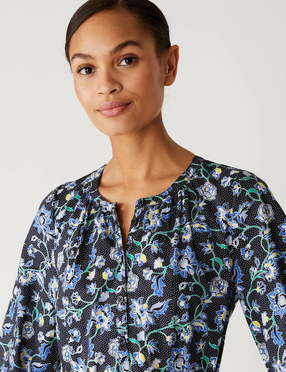 The neckline isn't too revealing and is fastened via a row of cute buttons. (Marks & Spencer)