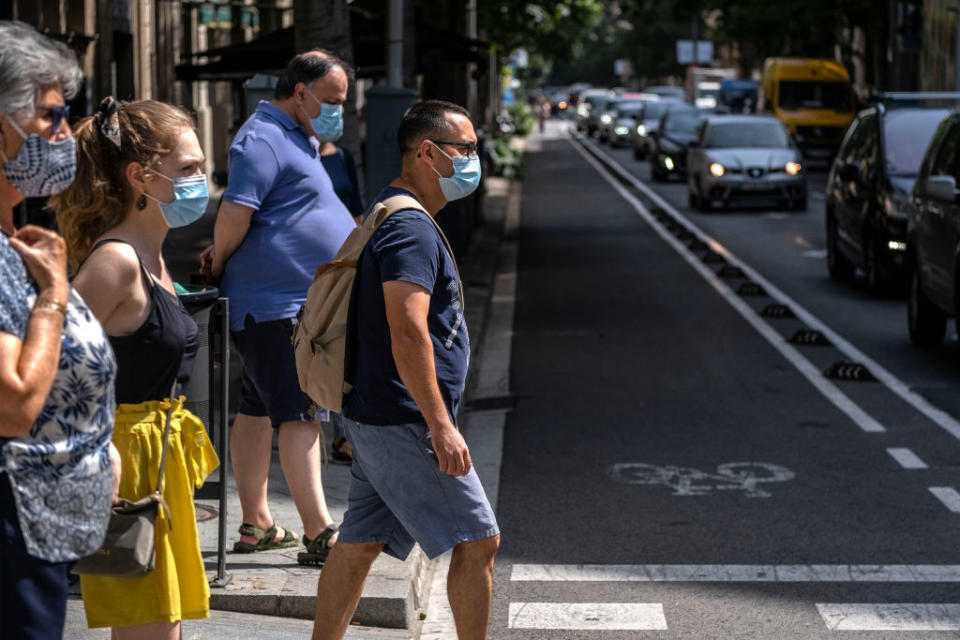 BARCELONA, CATALONIA, SPAIN - 2020/07/09: People wearing face masks as a precaution against the spread of the coronavirus during the pandemic. Catalonia will fine whoever does not wear a sanitary mask in public space with 100 euros, as a measure due to the Covid-19 outbreak. (Photo by Paco Freire/SOPA Images/LightRocket via Getty Images)