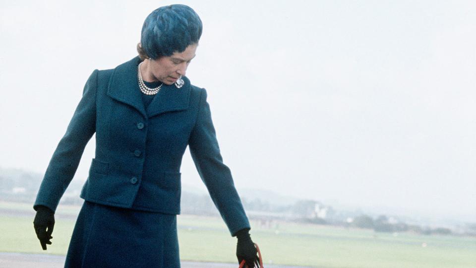 Queen Elizabeth ll arrives at Aberdeen Airport with her corgis to start her holidays in Balmoral, Scotland in 1974