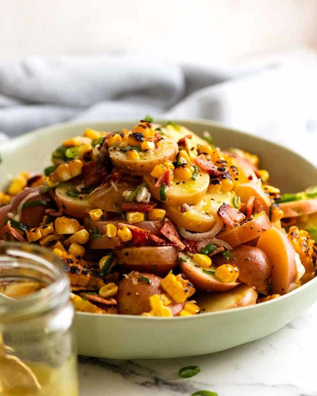 <p>Recipe Tin Eats</p><p>Red potato salad with crispy bacon bits and charred corn drizzled with a cider vinegar dressing, and no mayonnaise at all!</p><p><strong>Get the recipe: <a href="https://www.recipetineats.com/red-potato-salad-with-bacon-and-corn-no-mayo/" rel="nofollow noopener" target="_blank" data-ylk="slk:Red Potato Salad with Bacon and Corn (No Mayo);elm:context_link;itc:0;sec:content-canvas" class="link rapid-noclick-resp">Red Potato Salad with Bacon and Corn (No Mayo)</a></strong></p>