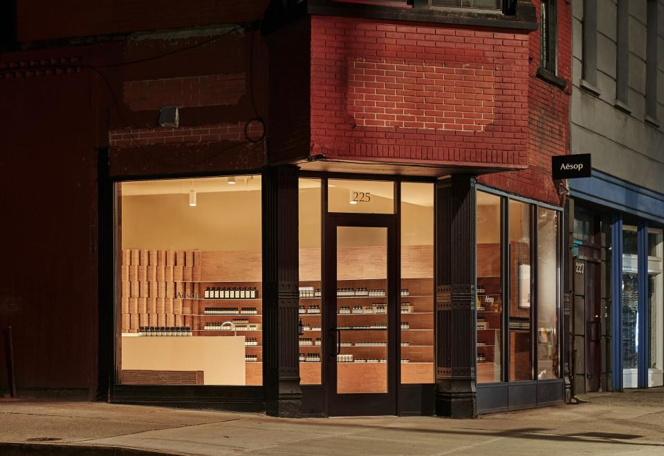 During the evening, the store's tawny interior creates a welcoming glow.