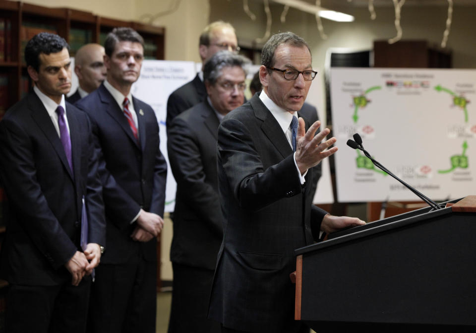 Lanny Breuer, right, Assistant Attorney General of the Justice Department's Criminal Division, addresses a news conference in Brooklyn, N.Y., Tuesday, Dec. 11, 2012. British bank HSBC has agreed to pay $1.9 billion to settle a New York based-probe in connection with the laundering of money from narcotics traffickers in Mexico, U.S. authorities announced Tuesday. Joining Breuer are, from left, Treasury Under Secretary David Cohen; Director of U.S. Immigration and Customs Enforcement John Morton; and Comptroller of the Currency Thomas Curry. (AP Photo/Richard Drew)