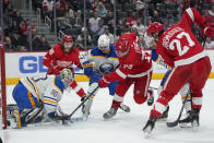 Buffalo Sabres goaltender Aaron Dell (80) stops a Detroit Red Wings left wing Adam Erne (73) shot in the second period of an NHL hockey game Saturday, Jan. 15, 2022, in Detroit. (AP Photo/Paul Sancya)