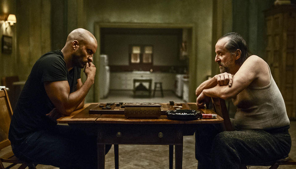 <p>Ricky Whittle as Shadow Moon and Peter Stormare as Czernobog in Starz’ <i>American Gods</i>.<br><br>(Photo: Starz) </p>