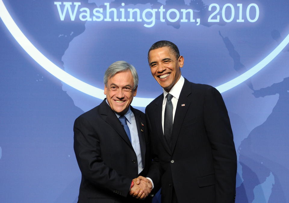 U.S. President Barack Obama greets Chilean President Sebastian Pinera before a dinner at the Washington Convention Center during the Nuclear Security Summit in Washington, D.C., on April 12, 2010.