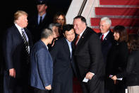 <p>President Donald Trump (L) looks on as U.S. detainees Tony Kim (center L) receives a hug from Secretary of State Mike Pompeo upon their return after they were freed by North Korea, at Joint Base Andrews in Maryland on May 10, 2018. (Photo: Nicholas Kamm/AFP/Getty Images) </p>