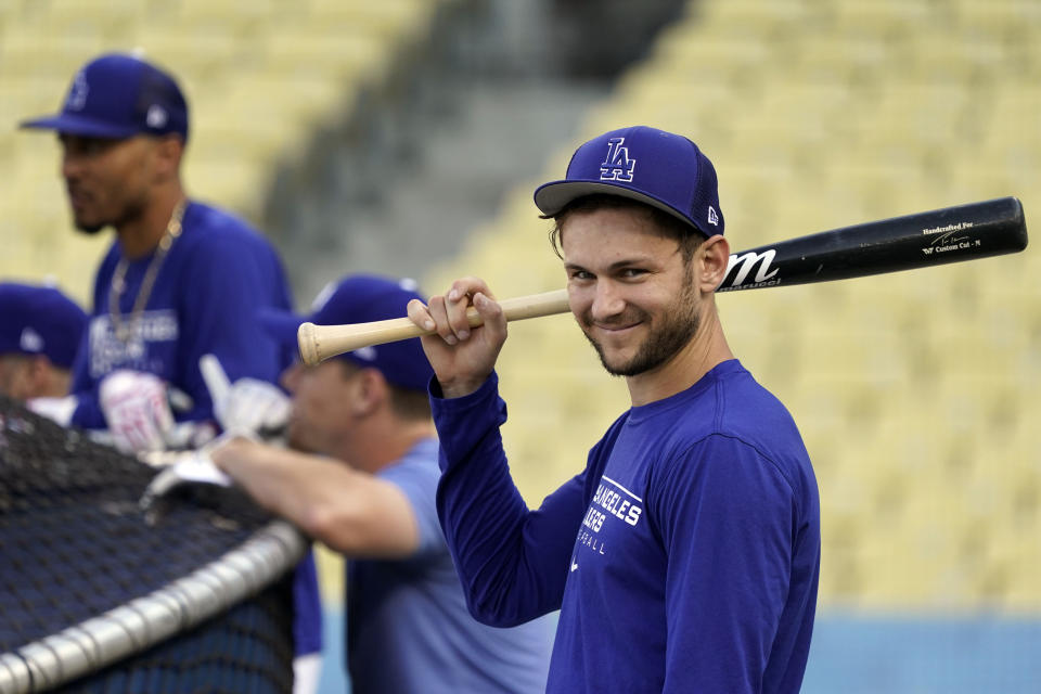 FILE - Los Angeles Dodgers' Trea Turner, right, smiles during batting practice ahead of Game 1 of a baseball NL Division Series, Friday, Oct. 7, 2022, in Los Angeles. The Philadelphia Phillies landed Trea Turner on Monday, Dec. 5, 2022, agreeing to a $300 million, 11-year contract with the dynamic shortstop. (AP Photo/Marcio Jose Sanchez, File)