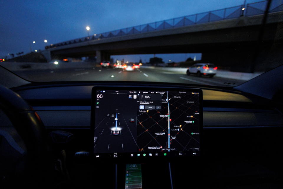 A Tesla Model 3 vehicle drives on autopilot along the 405 highway in Westminster, California, U.S., March 16, 2022. REUTERS/Mike Blake