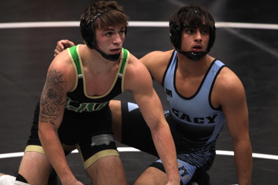 Harrison senior Cohl Wandsnider, left, finished second to Legacy Christian senior Brayden Brown at 150 during the championship finals of the Southwest Ohio Wrestling Coaches Association Coaches Classic wrestling tournament Dec. 23, 2023 at Middletown High School's arena.