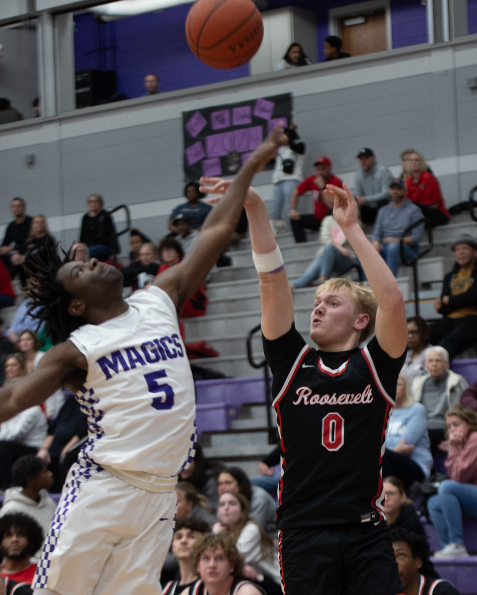 Kent Roosevelt's Jack Smith takes a shot as Barberton's Kardiay Tyler defends on Feb. 9, 2024.