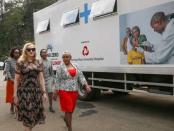 Singer-songwriter Madonna Ciccone walks with Kenyan First Lady Margaret Kenyatta (R) in front of a "Beyond Zero" mobile clinic at State House in Nairobi, Kenya, July 4, 2016. REUTERS/Presidential Press Service/Handout via REUTERS