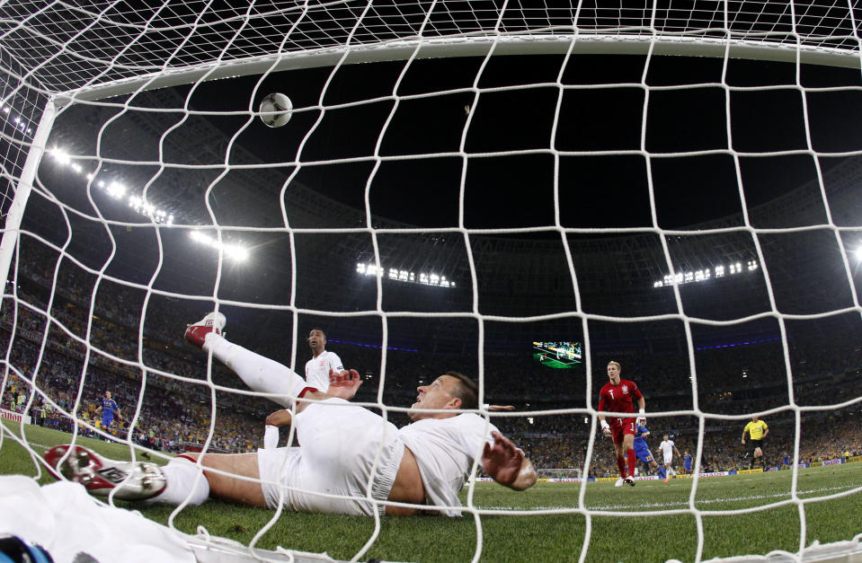 England's John Terry clears the ball away from his goal during the Euro 2012 soccer championship Group D match between England and Ukraine in Donetsk, Ukraine, Tuesday, June 19, 2012. (AP Photo/Matthias Schrader)