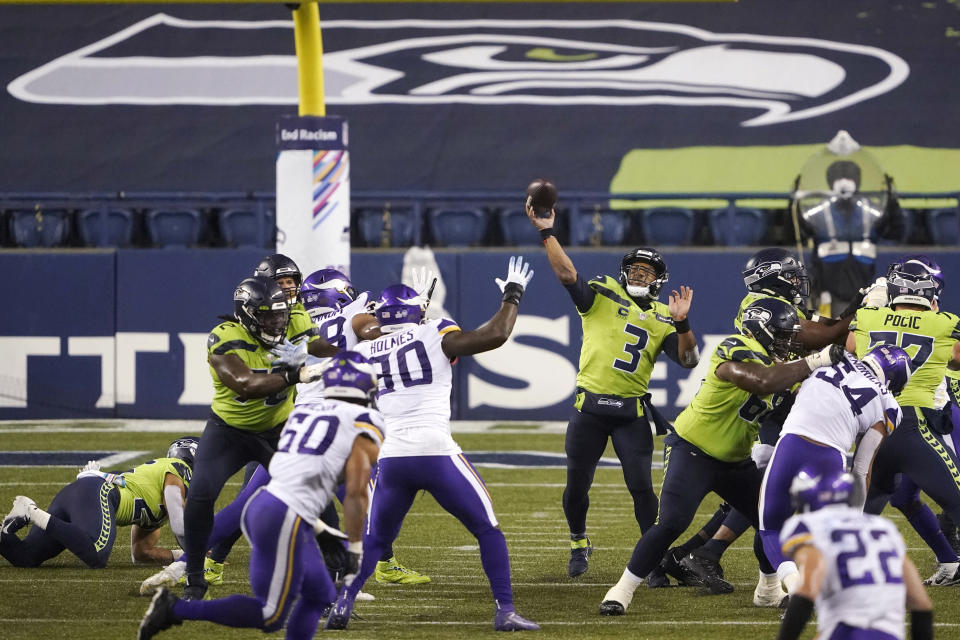 Seattle Seahawks quarterback Russell Wilson passes against the Minnesota Vikings late in the second half of an NFL football game, Sunday, Oct. 11, 2020, in Seattle. (AP Photo/Ted S. Warren)