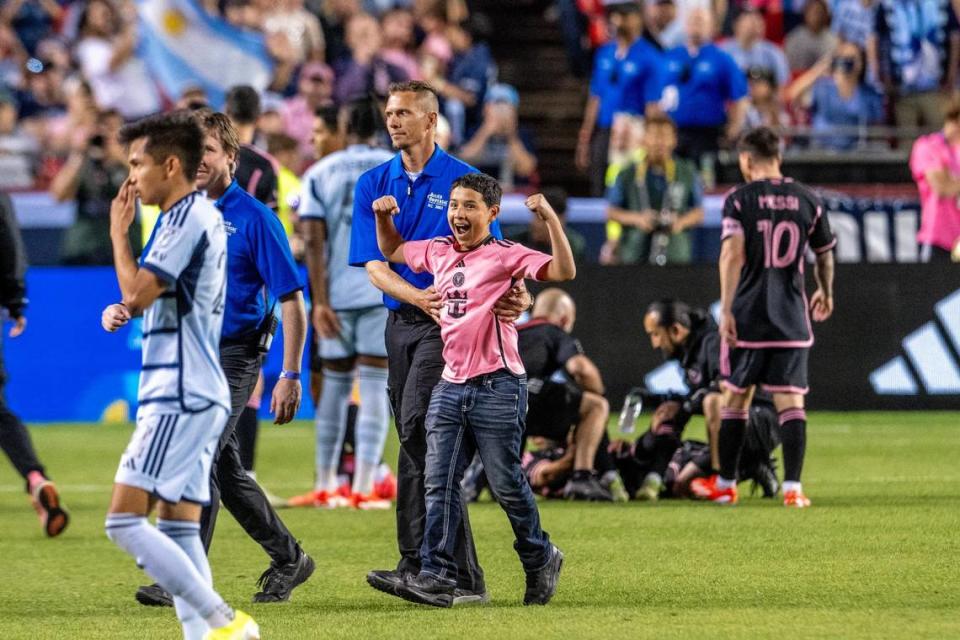 A young Inter Miami fan cheers to the crowd after taking a photo with forward Lionel Messi (10) in the second half during an MLS game against Sporting Kansas City at GEHA Field at Arrowhead Stadium on Saturday, April 13, 2024, in Kansas City.