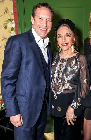<p>Dave Benett/Getty</p> Percy Gibson and Joan Collins attended Gabriela Peacock's book launch at the Broadwick Soho on April 23