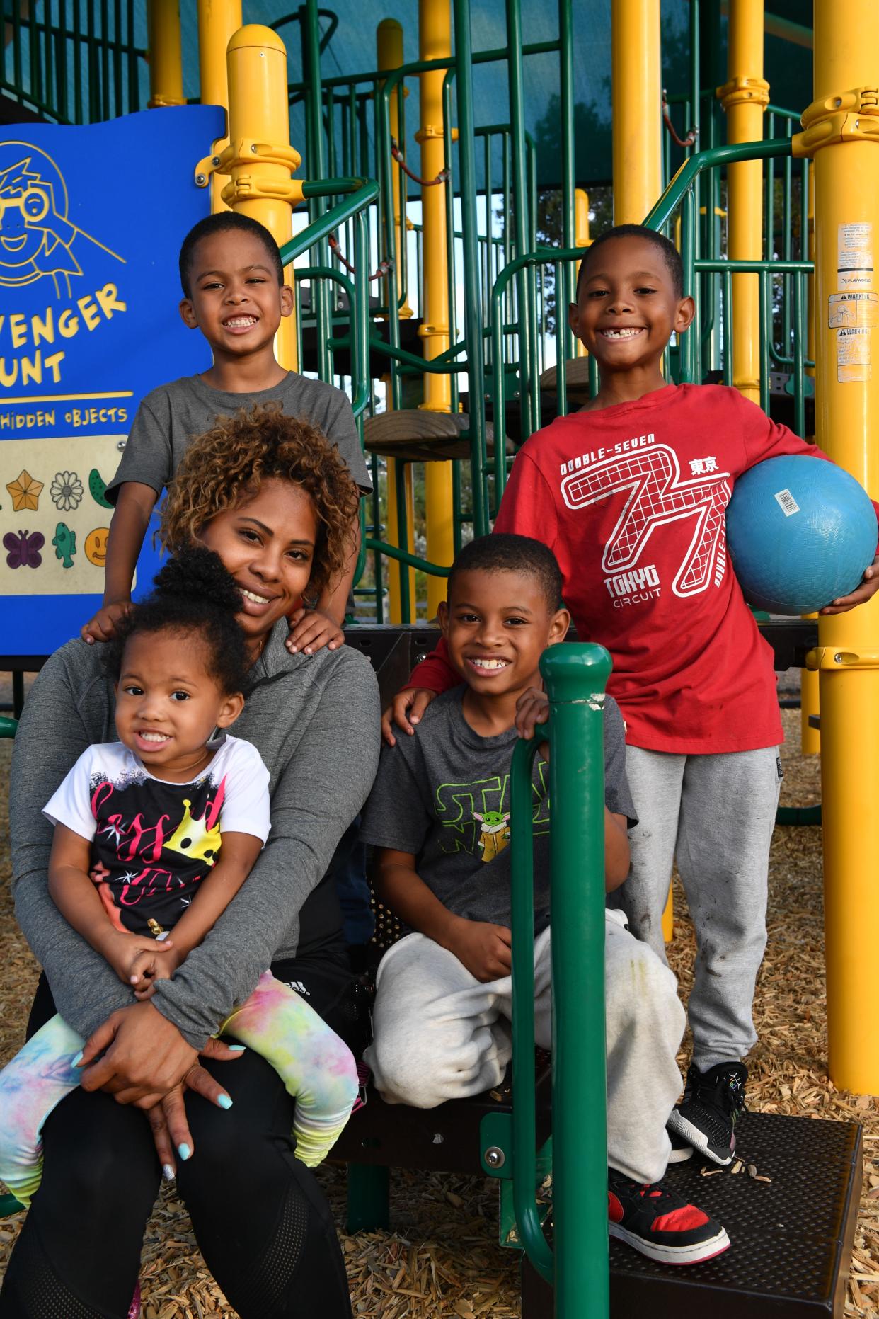 Cierra Harris with her daughter, Cariah, 2, and sons Tavias, 6, back left; Takai, 8, center; and Tazeon, 7, right.