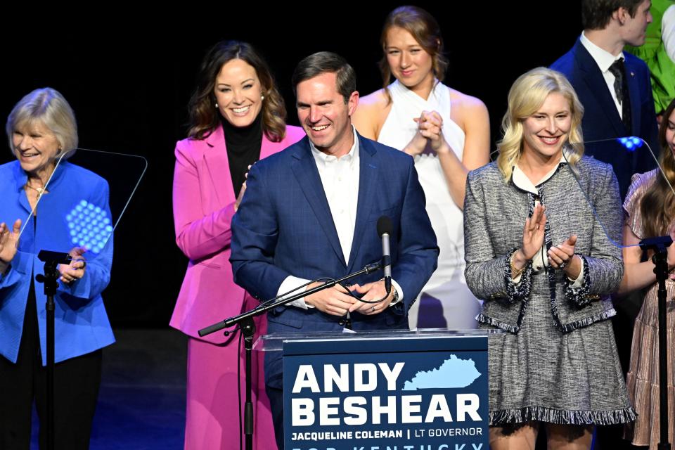 Kentucky incumbent Democratic Gov. Andy Beshear is joined by his wife, Britainy Beshear (R), Kentucky Lt. Governor Jacqueline Coleman (C-L) and his family as he delivers his victory speech to a crowd at an election night event at Old Forrester's Paristown Hall on November 7, 2023 in Louisville, Kentucky.