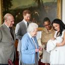 Cameras caught when Queen Elizabeth and Prince Philip met their new great-grandson, with Meghan's mother Doria (a first-time grandmother!) also standing by.