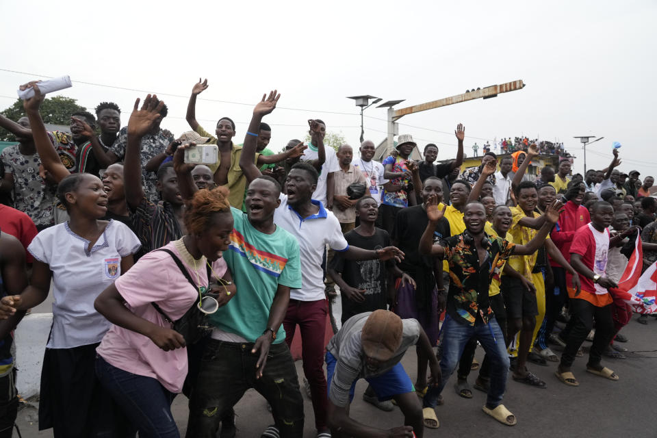 People cheer at Pope Francis as he arrives in Kinshasa, Democratic Republic of the Congo, Tuesday, Jan. 31, 2023 to start his six-day pastoral visit to Congo and South Sudan where he'll bring a message of peace to countries riven by poverty and conflict. (AP Photo/Gregorio Borgia)