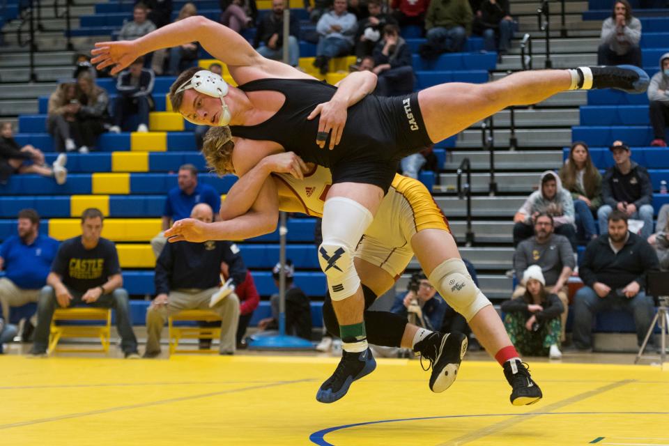 Mater Dei's Gabe Sollars decisioned Castle's John Purdy (front) 9-4 on Saturday in the SIAC meet at Castle in a battle of the state's No. 1 and 2 wrestlers at 195.