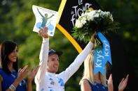 Great Britain's Adam Yates celebrates his white jersey of best young rider on July 24, 2016