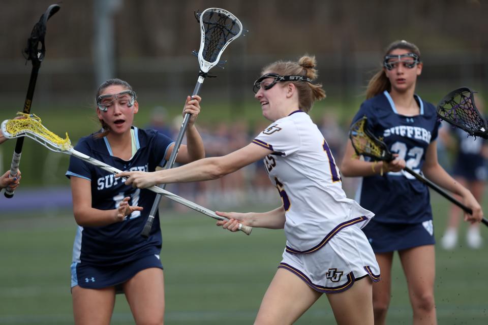 John Jay's Shannon Nolan (16) fires a shot against Suffern' during girls lacrosse action at John Jay High School in Cross River High  April 11, 2023. John Jay won the game 17-9.