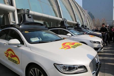 Baidu's Apollo autonomous cars are seen during a public road test for self-driving vehicles in Beijing, China March 22, 2018. REUTERS/Stringer