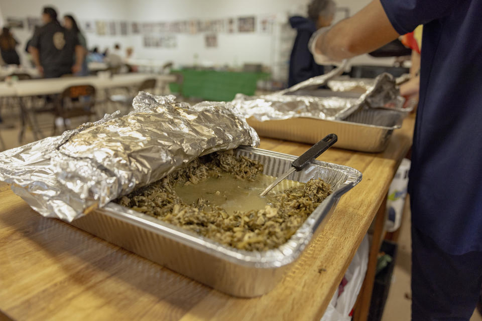 A tray of wild onions ready to be served is set on a counter at the Springfield United Methodist Church's annual wild onion dinner in Okemah, Okla., on April 6, 2024. Wild onions are among the first foods to grow wild in the spring, and for generations Native American communities in Oklahoma have gathered every year to pick and cook them together. (AP Photo/Brittany Bendabout)