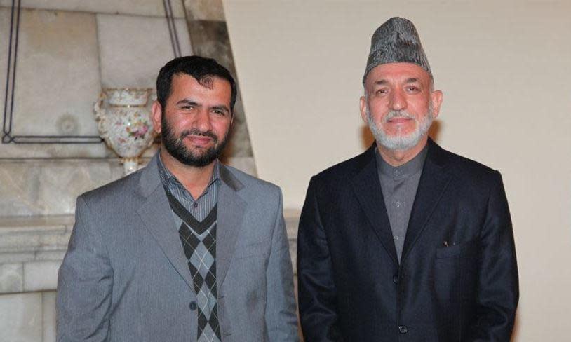 CBS News producer Sami Yousafzai, left, is seen with then-President of Afghanistan Hamid Karzai in Kabul, in 2013. / Credit: Courtesy of Sami Yousafzai