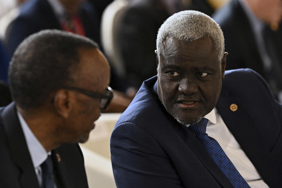 Chairperson of the African Union Commission Moussa Faki Mahamat, right, speaks with Rwanda's President Paul Kagame during the African Vaccine Manufacturing Accelerator conference, Thursday, June 20, 2024 in Paris. French President Emmanuel Macron joined some African leaders on Thursday to kick off a planned $1 billion project to accelerate the rollout of vaccines in Africa, after the coronavirus pandemic bared gaping inequalities in access to them. (Dylan Martinez/Pool via AP)