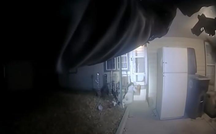 This image from police body cam video provided by the City of Lawton, OKla., shows police approaching Quadry Sanders after he was shot by police on Dec. 5, 2021