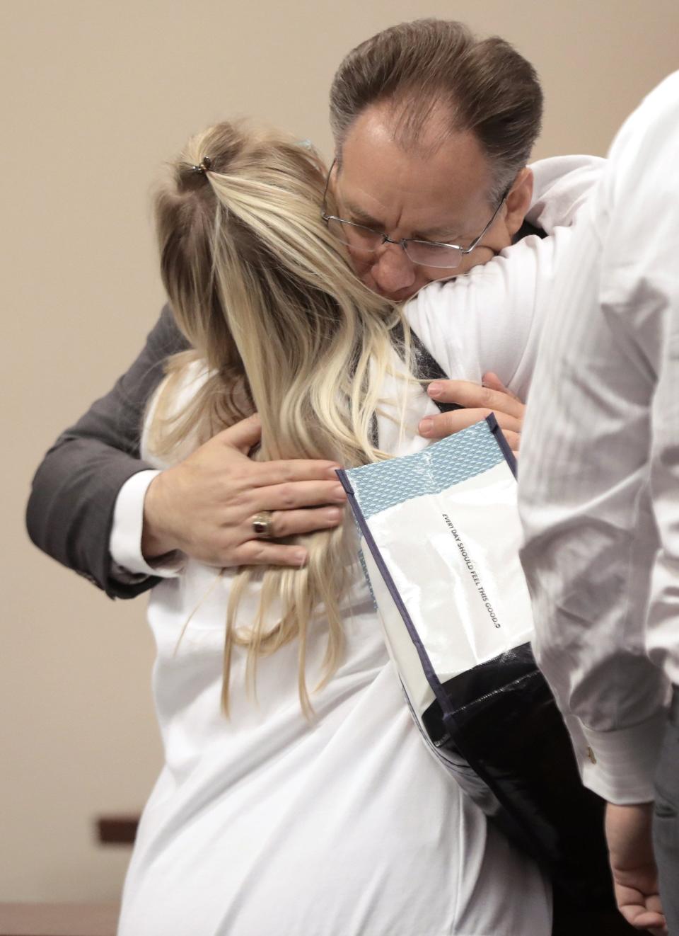 Stacy Bailey, the mother of Tristyn Bailey, hugs Assistant State Attorney Mark Johnson at the conclusion of Monday's surprise plea in the murder of her 13-year-old daughter. Aiden Fucci pleaded guilty to first-degree murder with a minimum sentence of 40 years in prison up to life. Jury selection had been scheduled for that morning at the St. Johns County Courthouse. Fucci was 14 when he stabbed his classmate the early morning of May 9, 2021.