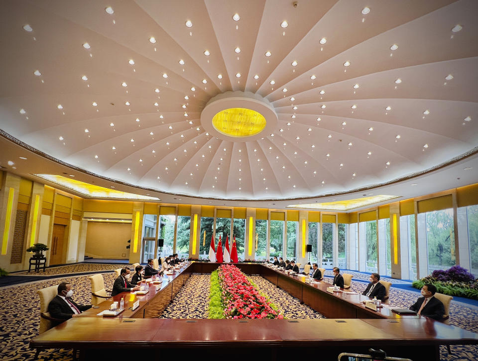 In this photo released by the Press and Media Bureau of the Indonesian Presidential Palace, Indonesian President Joko Widodo, fourth left, meets with Chinese Premier Li Keqiang, fourth right, in Beijing, China, Tuesday, July, 26, 2022. Widodo arrived in Beijing on Monday night on the first stop of a trip that will also take him to Japan and South Korea later this week. (Laily Rachev/Indonesian Presidential Palace via AP)