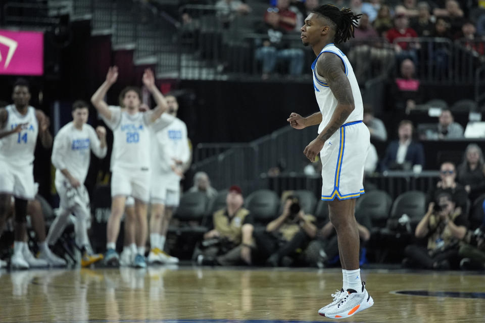 UCLA guard Dylan Andrews (2) celebrates after scoring against Oregon State during the first half of an NCAA college basketball game in the first round of the Pac-12 tournament Wednesday, March 13, 2024, in Las Vegas. (AP Photo/John Locher)