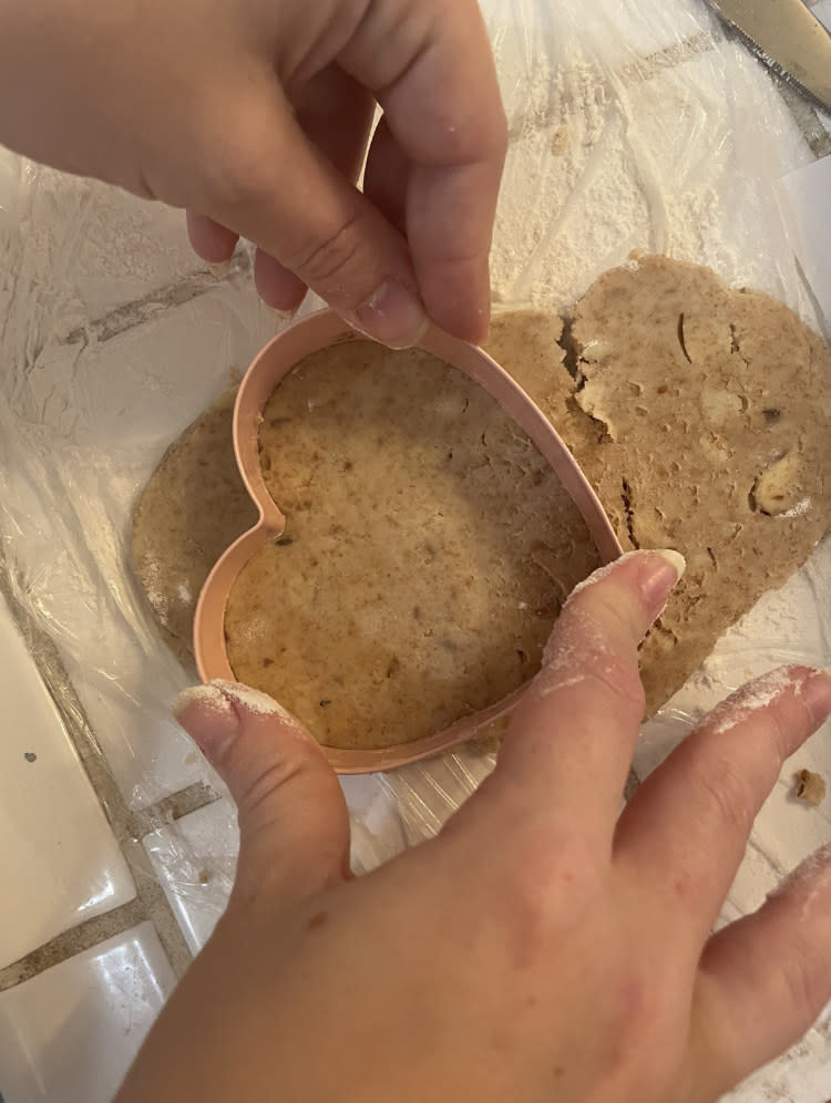 heart-shaped cookie cutter being used