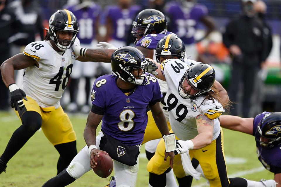 Baltimore Ravens Lamar Jackson tries to avoid a Steelers rush in their November 2020 game in Baltimore.