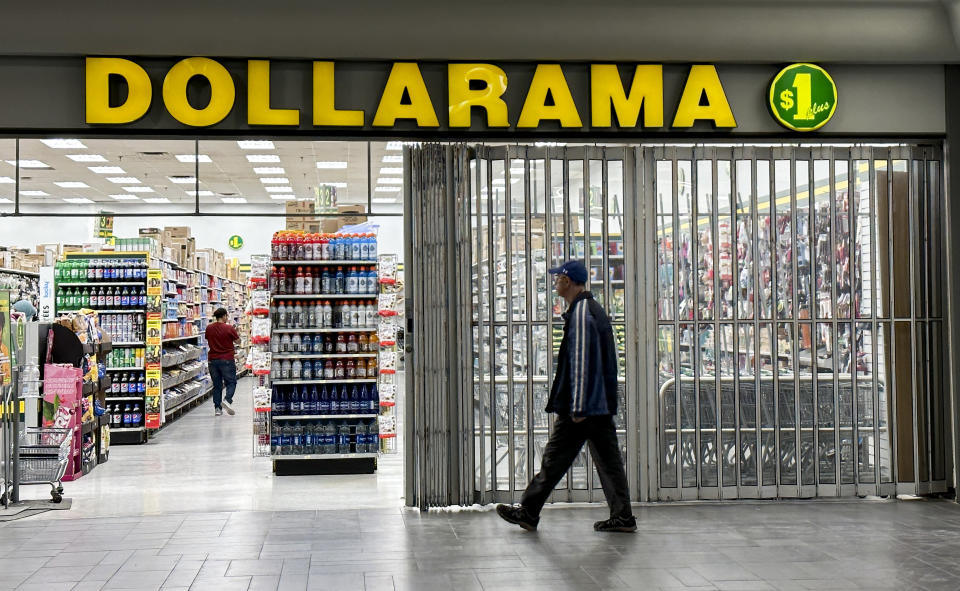 A person walks into a Dollarama store in Montreal, Wednesday, June 7, 2023. THE CANADIAN PRESS/Christinne Muschi