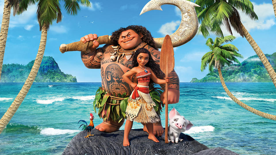 Maui and Moana standing on a rock in front of a beautiful Pacific scene