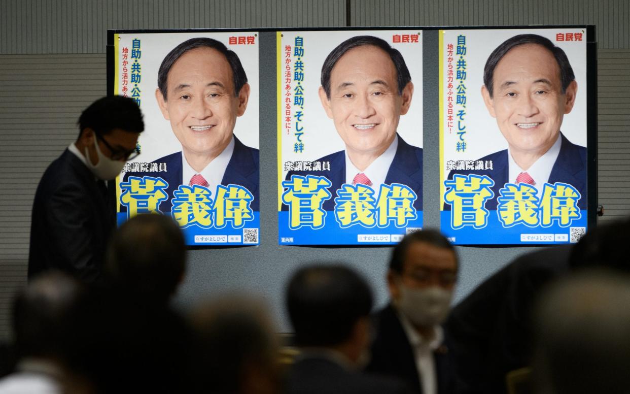 Posters of Yoshihide Suga, Japan's chief cabinet secretary - Akio Kon/Bloomberg