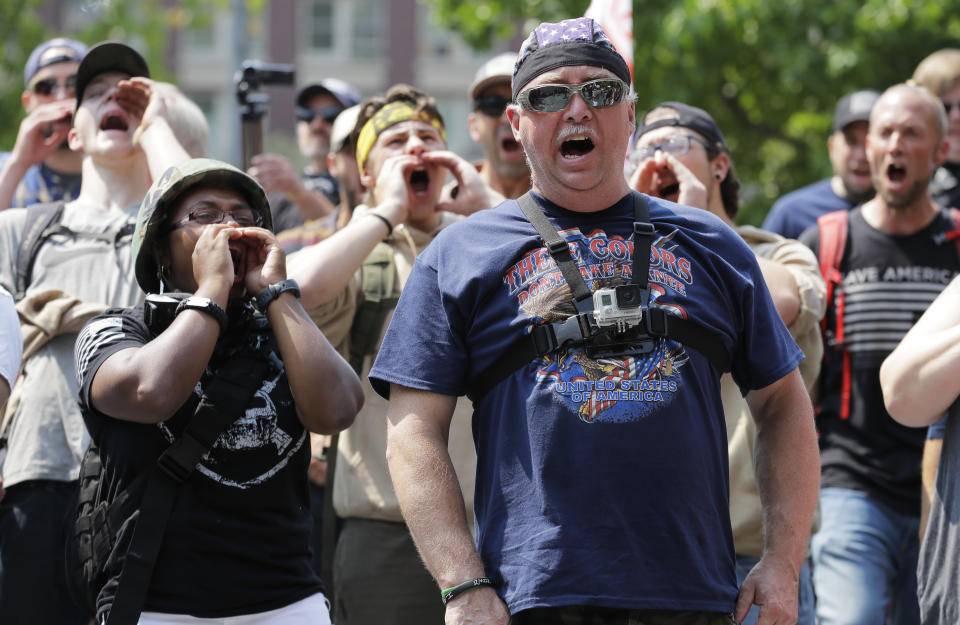 Supporters of a rally held by members of Patriot Prayer and other groups advocating for gun rights yell and cheer, Saturday, Aug. 18, 2018, at City Hall in Seattle. (AP Photo/Ted S. Warren)