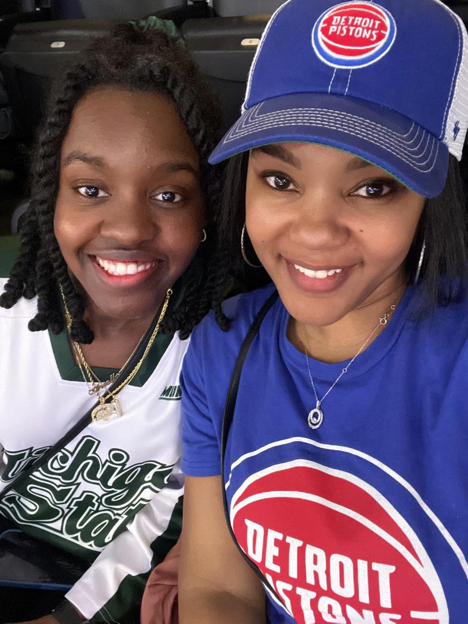 Dawana Davis, left, and her daughter Arielle Anderson take a selfie during a Detroit Pistons game on Feb. 10 during the team's College Night recognizing Michigan State University. Anderson was killed during a mass shooting on MSU's campus three days later.