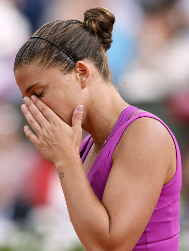 Italy's Sara Errani reacts as she plays with Russia's Maria Sharapova during their Women's Singles final tennis match of the French Open tennis tournament at the Roland Garros stadium, on June 9, 2012 in Paris. AFP PHOTO / PATRICK KOVARIKPATRICK KOVARIK/AFP/GettyImages