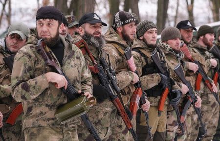 Pro-Russian separatists from the Chechen "Death" battalion stand in a line during a training exercise in the territory controlled by the self-proclaimed Donetsk People's Republic, eastern Ukraine, December 8, 2014. REUTERS/Maxim Shemetov